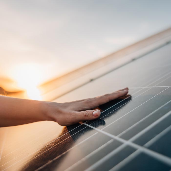 hand on solar panel